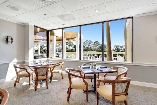 dining area with baseboards, healthy amount of natural light, carpet floors, recessed lighting, and crown molding
