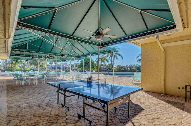 view of patio / terrace with a ceiling fan and outdoor dining area