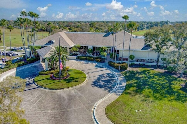 view of community with curved driveway