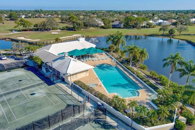 bird's eye view of a nearby body of water and a pool