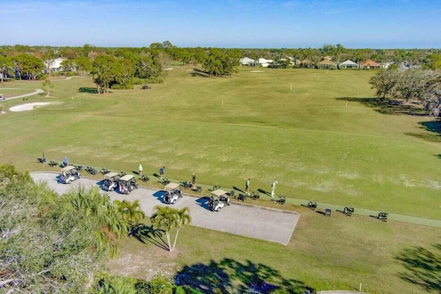 view of property location with a tree filled landscape