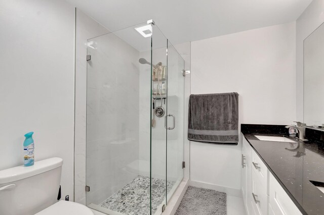 full bath with toilet, a shower stall, and vanity