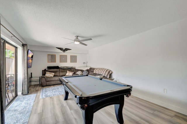 game room featuring ceiling fan, light wood-style floors, a textured ceiling, electric panel, and pool table