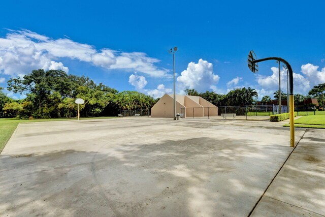 view of sport court with fence