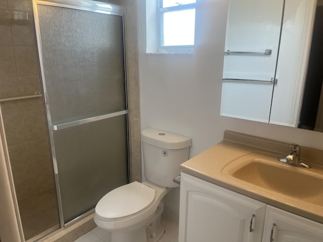full bathroom with vanity, a shower stall, and toilet