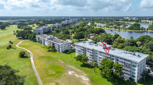 bird's eye view with a water view and golf course view