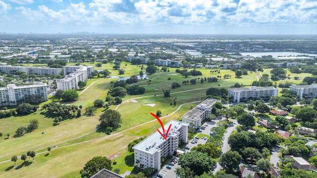 bird's eye view featuring a water view and golf course view