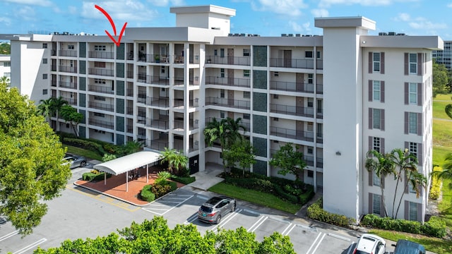 view of property with uncovered parking