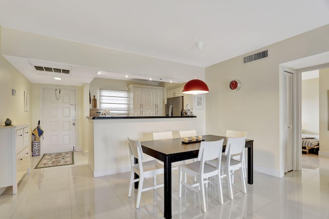 dining area featuring recessed lighting, baseboards, visible vents, and light tile patterned floors