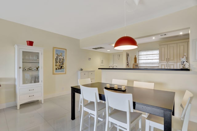 dining space featuring light tile patterned floors, baseboards, recessed lighting, and visible vents
