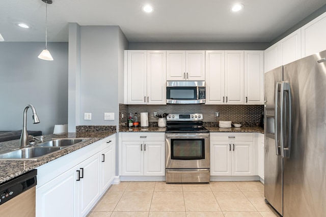 75 Atlantic Grove Way, Delray Beach, FL 33444 - kitchen with stainless steel appliances, a sink, white cabinetry, backsplash, and recessed lighting