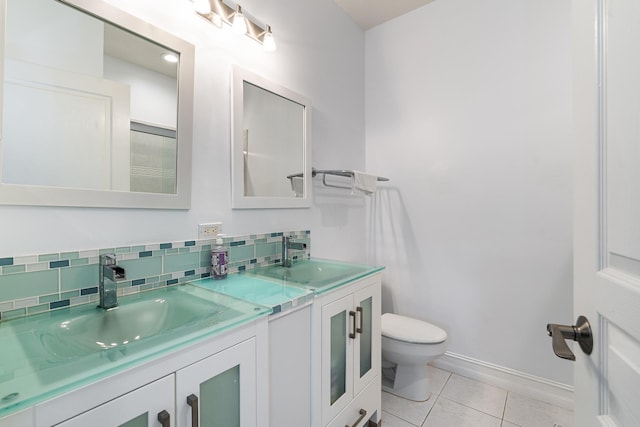75 Atlantic Grove Way, Delray Beach, FL 33444 - full bathroom featuring double vanity, toilet, tile patterned flooring, baseboards, and decorative backsplash