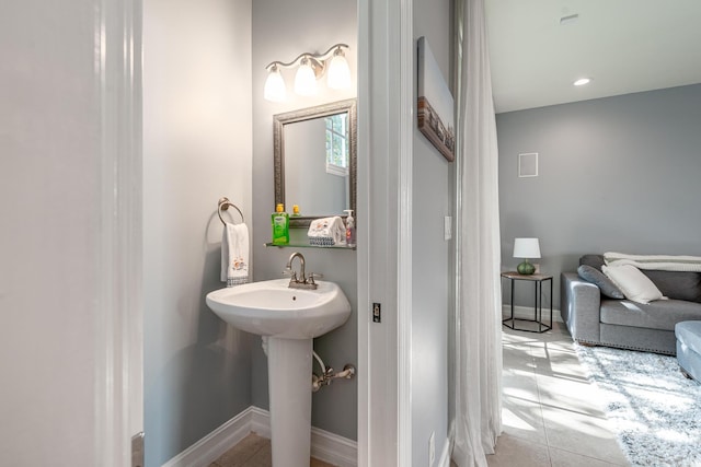 75 Atlantic Grove Way, Delray Beach, FL 33444 - bathroom featuring a sink, tile patterned floors, and baseboards