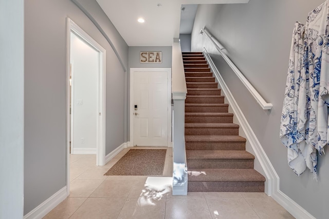 75 Atlantic Grove Way, Delray Beach, FL 33444 - foyer with stairway, light tile patterned floors, and baseboards