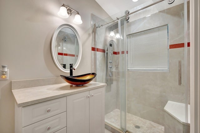 bathroom with a stall shower and vanity