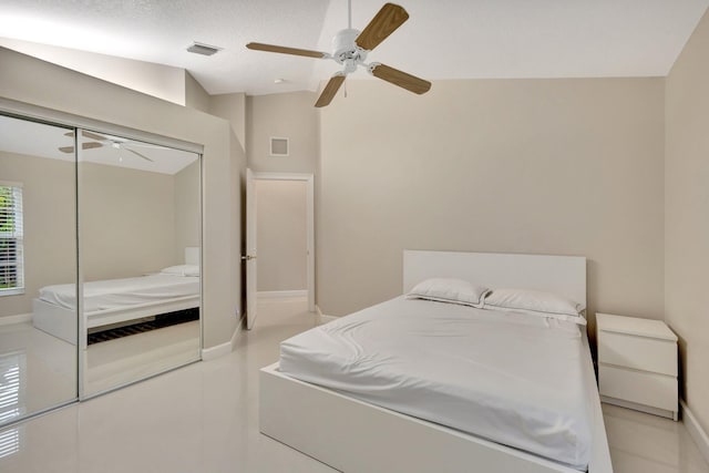 bedroom featuring a ceiling fan, baseboards, a closet, and visible vents