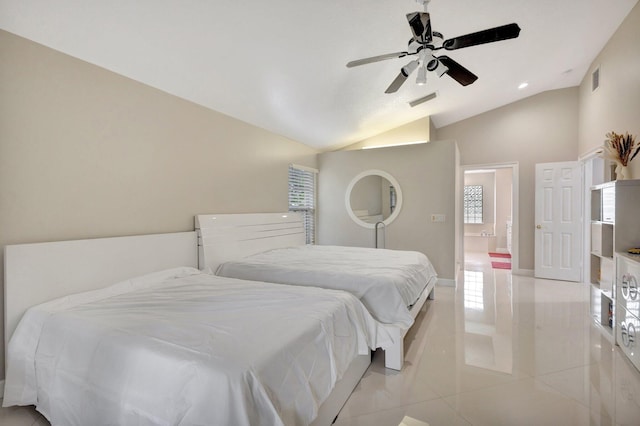 bedroom with lofted ceiling, ceiling fan, light tile patterned floors, and visible vents