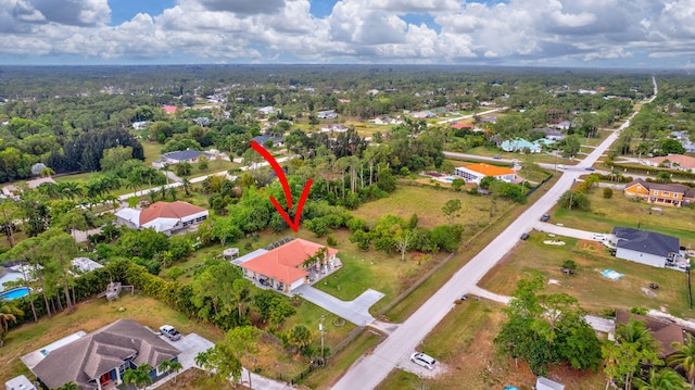 birds eye view of property with a residential view