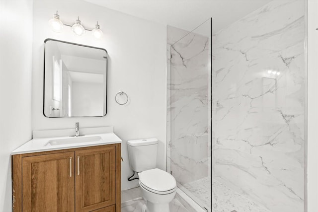 bathroom featuring a marble finish shower, vanity, toilet, and marble finish floor