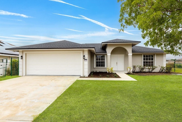 single story home with a garage, a front yard, stucco siding, a shingled roof, and driveway