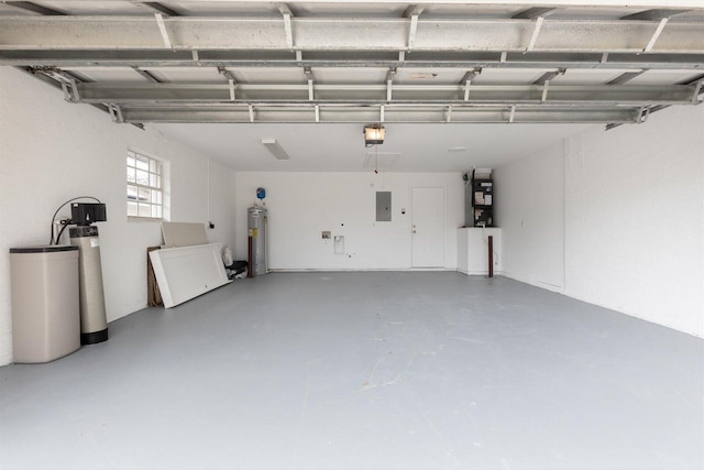 garage featuring a garage door opener, electric panel, and electric water heater