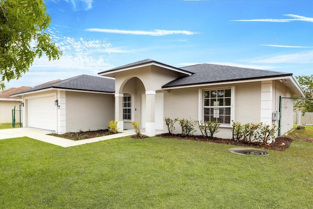 view of front of property with a garage, a front yard, stucco siding, a shingled roof, and concrete driveway