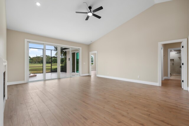 10206 Isle Of Pines Ct, Port Saint Lucie, FL 34986 - unfurnished living room featuring high vaulted ceiling, a ceiling fan, light wood finished floors, and baseboards