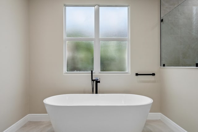 10206 Isle Of Pines Ct, Port Saint Lucie, FL 34986 - full bath with baseboards and a freestanding tub