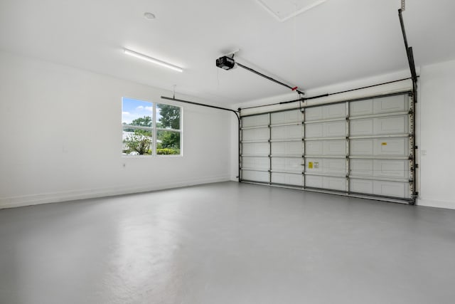garage featuring baseboards and a garage door opener
