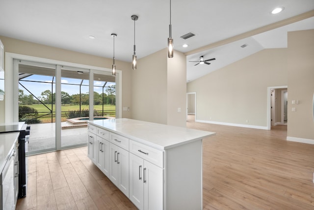 kitchen featuring ceiling fan, light wood-style flooring, white cabinetry, decorative light fixtures, and visible vents
