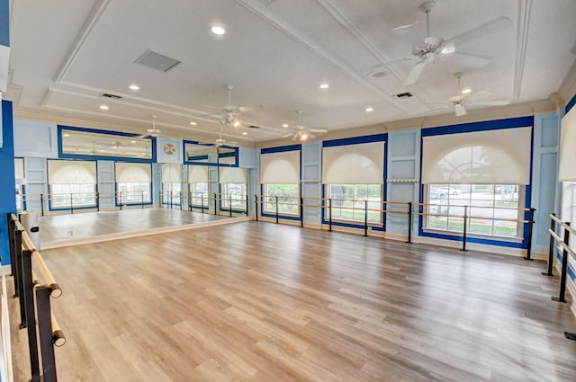 exercise area featuring a ceiling fan, ornamental molding, recessed lighting, and wood finished floors
