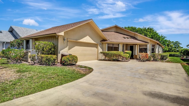 6231 SE Ames Way, Hobe Sound, FL 33455 - ranch-style home with a garage, driveway, a front lawn, roof with shingles, and stucco siding