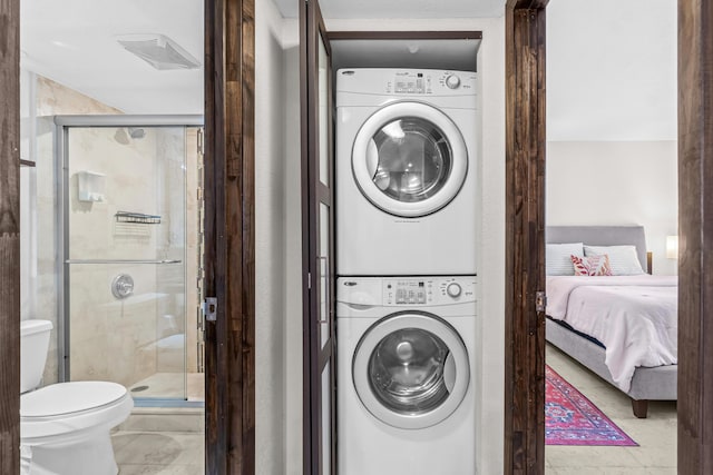 laundry area with stacked washing maching and dryer and laundry area