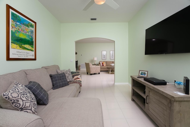520 NW Galatone Ct, Port Saint Lucie, FL 34986 - living room with visible vents, arched walkways, ceiling fan, and light tile patterned floors