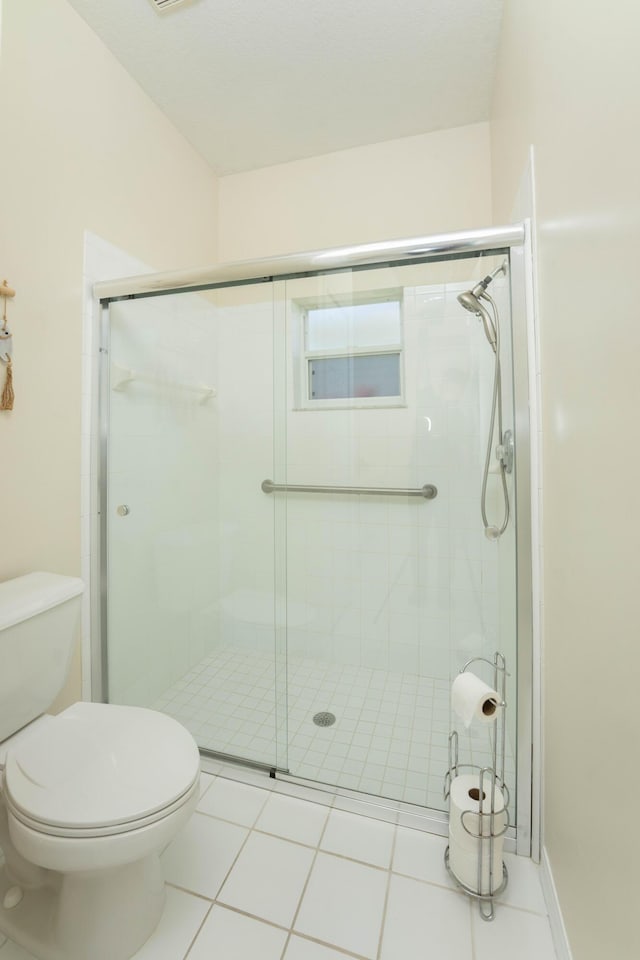 520 NW Galatone Ct, Port Saint Lucie, FL 34986 - full bath with tile patterned flooring, a shower stall, and toilet
