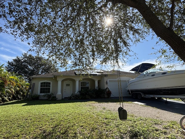 7746 99th Ct, Vero Beach, FL 32967 - ranch-style house with stucco siding, an attached garage, driveway, and a front yard