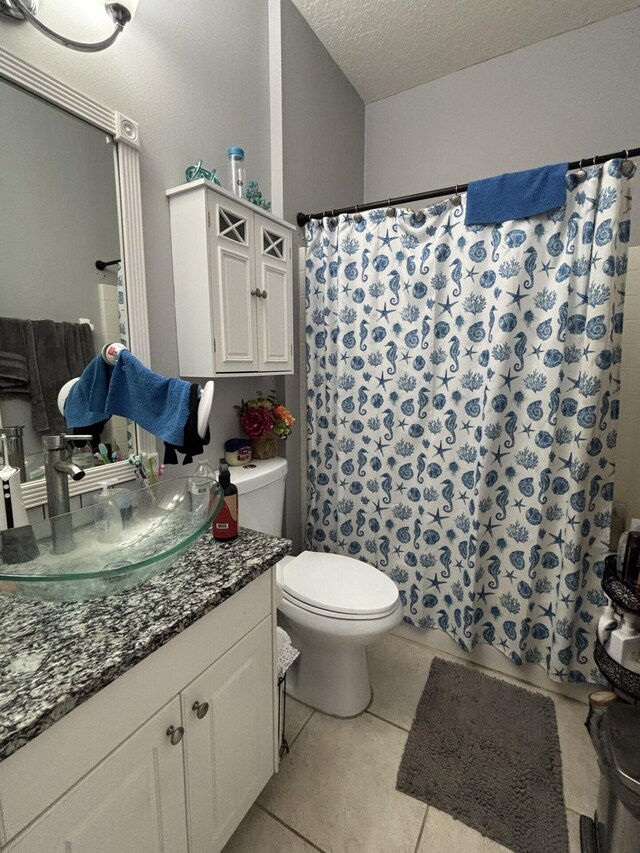 7746 99th Ct, Vero Beach, FL 32967 - full bath featuring toilet, a textured ceiling, tile patterned floors, and vanity