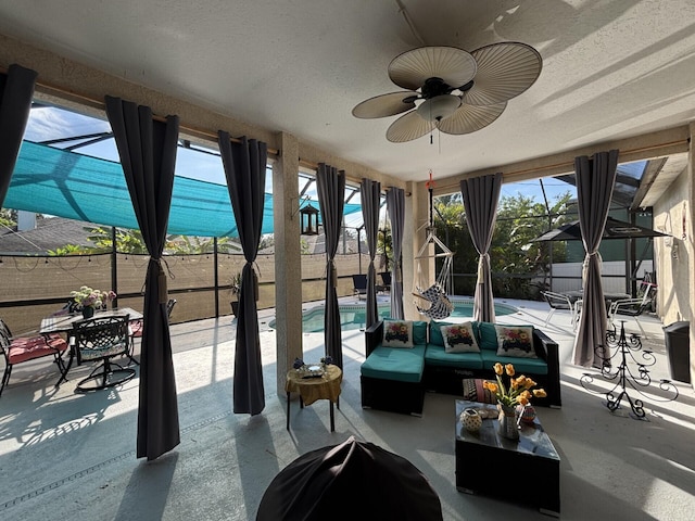 7746 99th Ct, Vero Beach, FL 32967 - view of patio with an outdoor hangout area, ceiling fan, a fenced in pool, a fenced backyard, and glass enclosure