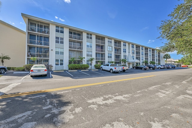 view of property with uncovered parking