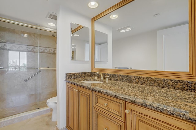 bathroom featuring vanity, toilet, tile patterned floors, recessed lighting, and a stall shower