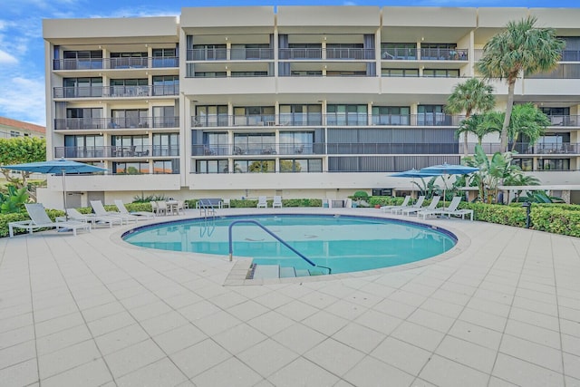 community pool with a patio area