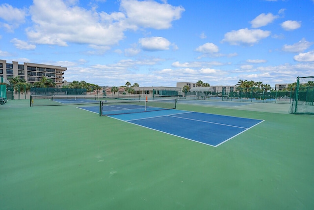 view of tennis court with fence