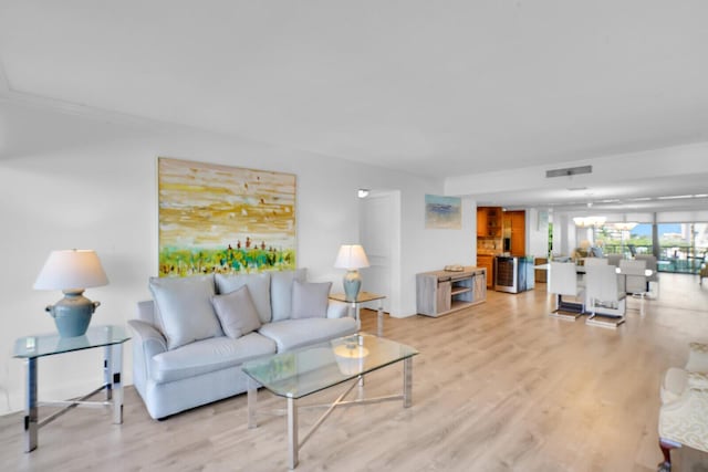 living area with light wood finished floors and visible vents