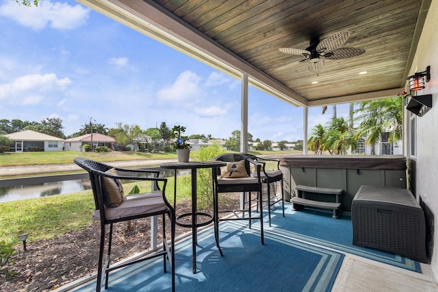 10867 Jefferson Way, Boynton Beach, FL 33437 - sunroom featuring a water view, ceiling fan, and a hot tub