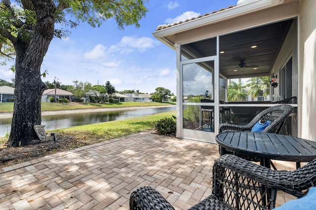 10867 Jefferson Way, Boynton Beach, FL 33437 - view of patio / terrace with a water view, ceiling fan, and a sunroom