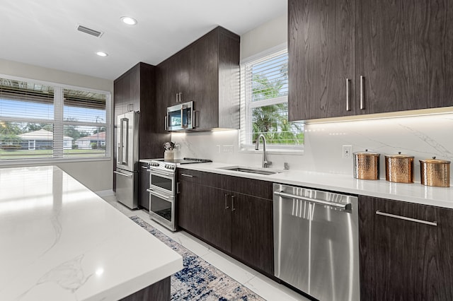 10867 Jefferson Way, Boynton Beach, FL 33437 - kitchen with dark brown cabinetry, appliances with stainless steel finishes, a sink, recessed lighting, and visible vents