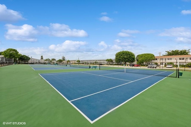 view of sport court featuring fence