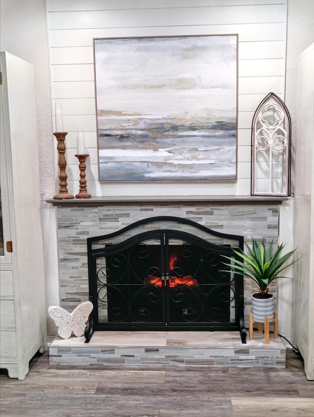 380 Laurie Rd, West Palm Beach, FL 33405 - detailed view of a tile fireplace and wood finished floors