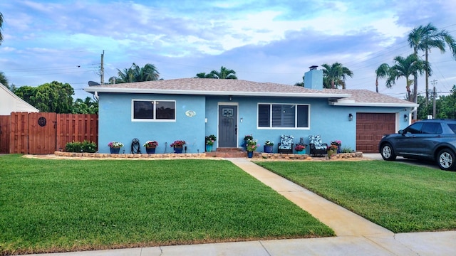 ranch-style house featuring an attached garage, stucco siding, fence, a front lawn, and roof with shingles