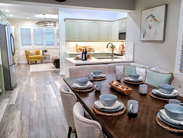 380 Laurie Rd, West Palm Beach, FL 33405 - dining area featuring light wood-style flooring, recessed lighting, and baseboards